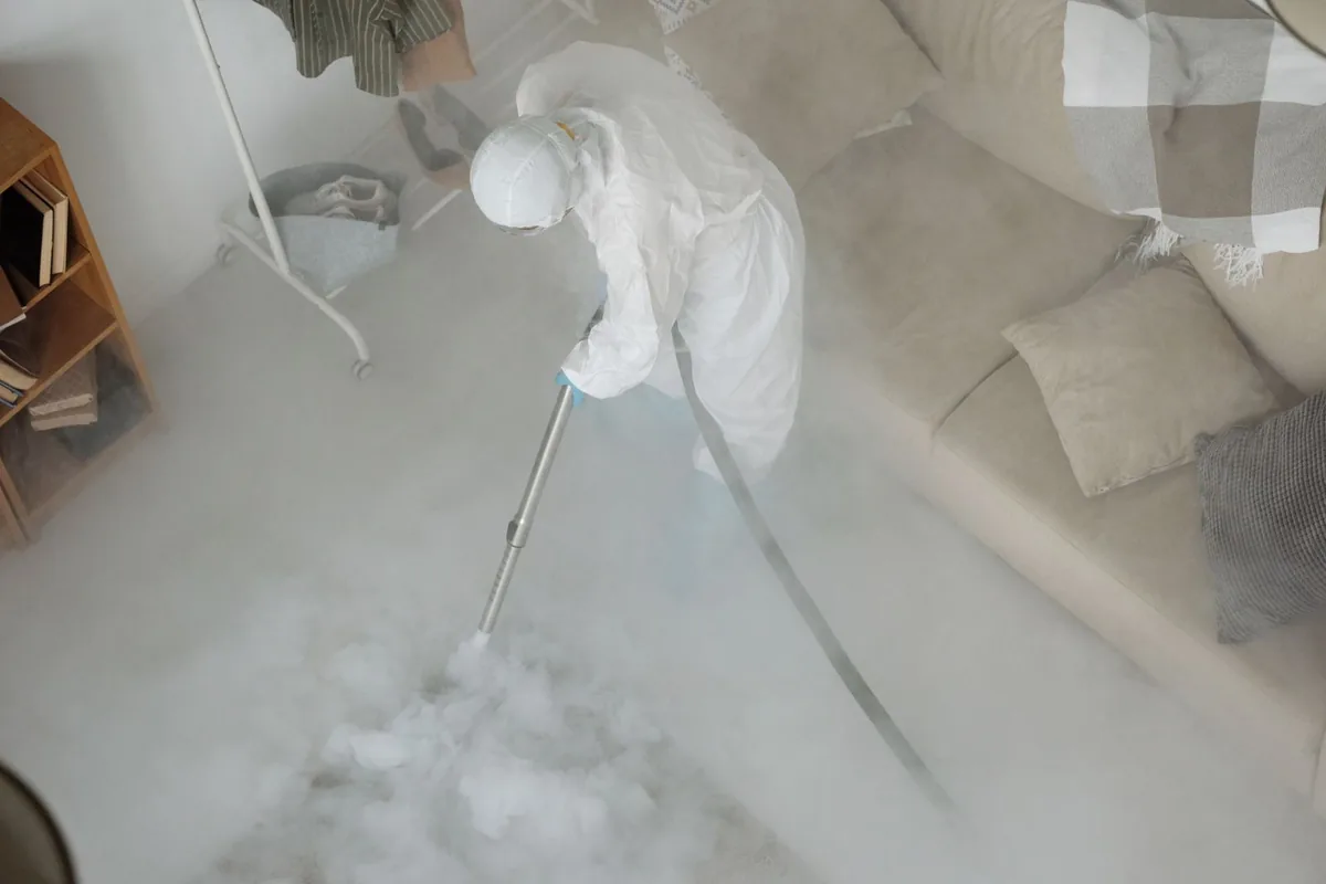 Biohazard cleanup technician in protective equipment, Alliance, OH